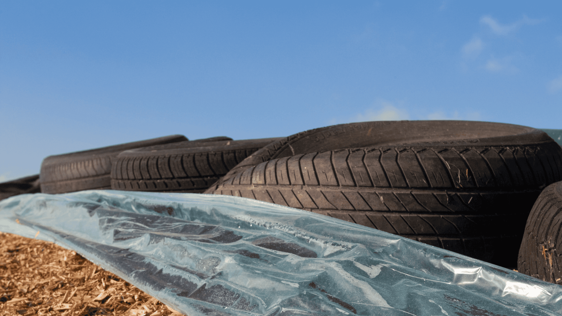 whole tires on silage plastic